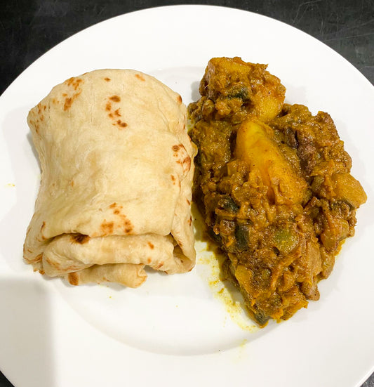Baigan curry with potato and eggplant in spiced curry sauce